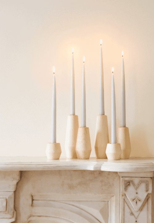 Tapered candle holders in three different sizes showing affordable luxury gifts