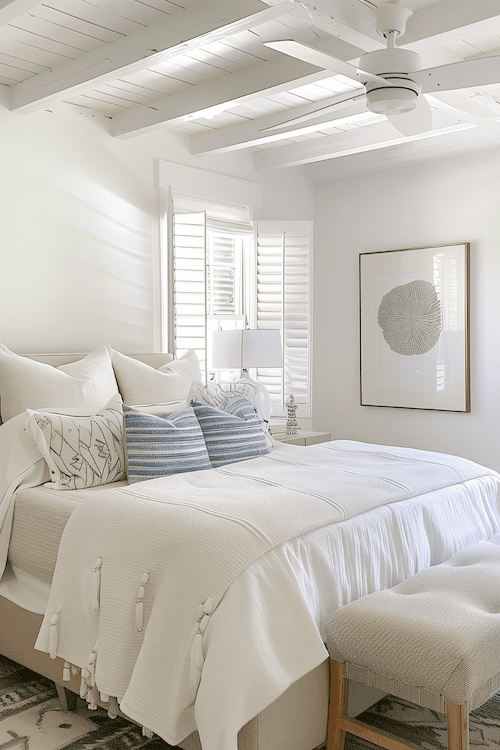 Light airy fabrics make a coastal bedroom feel fresh