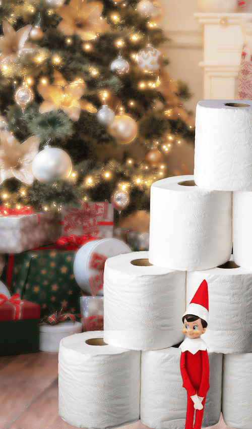 elf on the shel beside tower of toilet paper example of funny elf on the shelf ideas